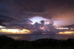 Hurricane season is also a great time for spectacular dramatic sunsets in the Caribbean. A sunset with rain clouds. Dominica, West Indies. Sept.2019.