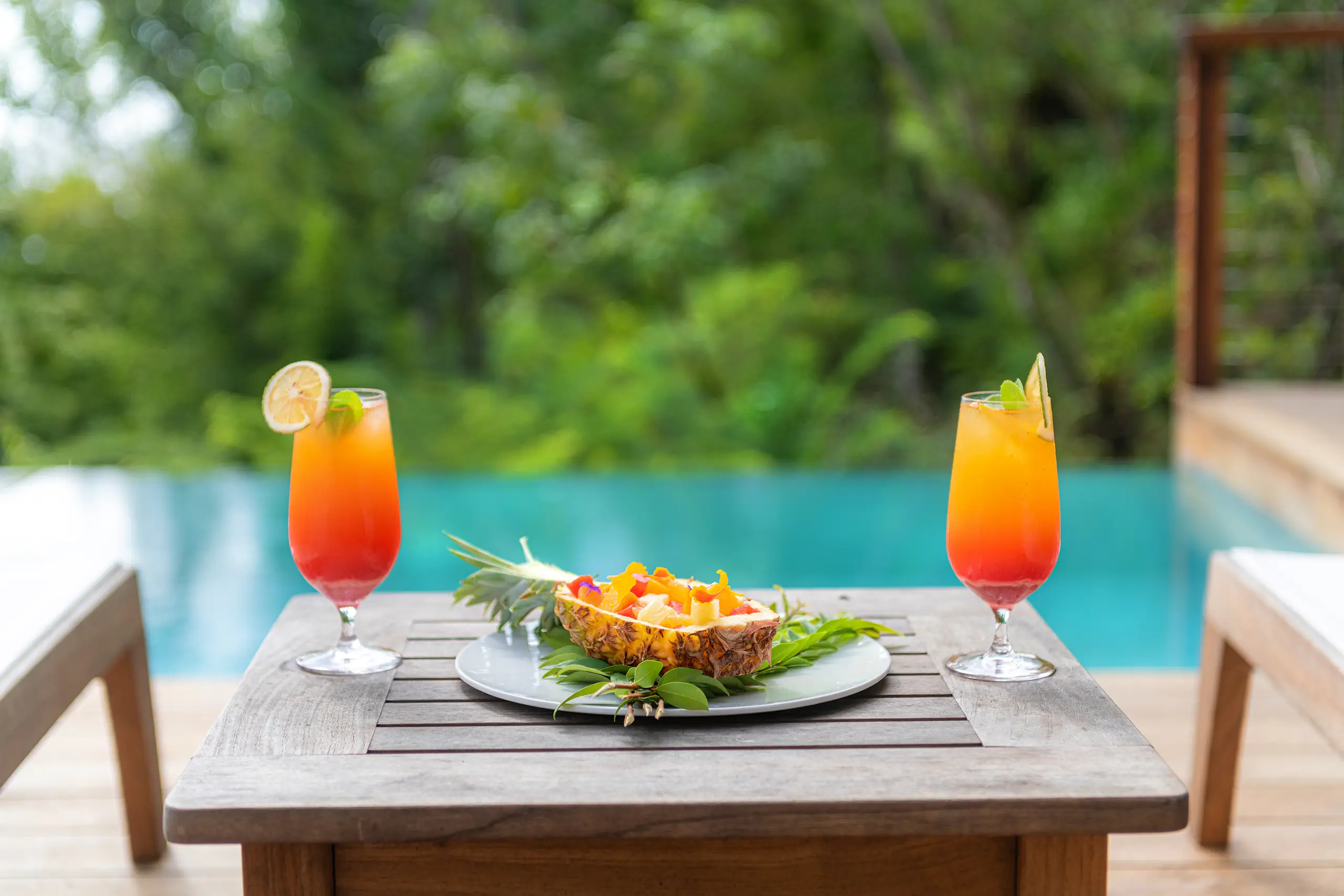 Rum punch at your pool, served with pineapple.